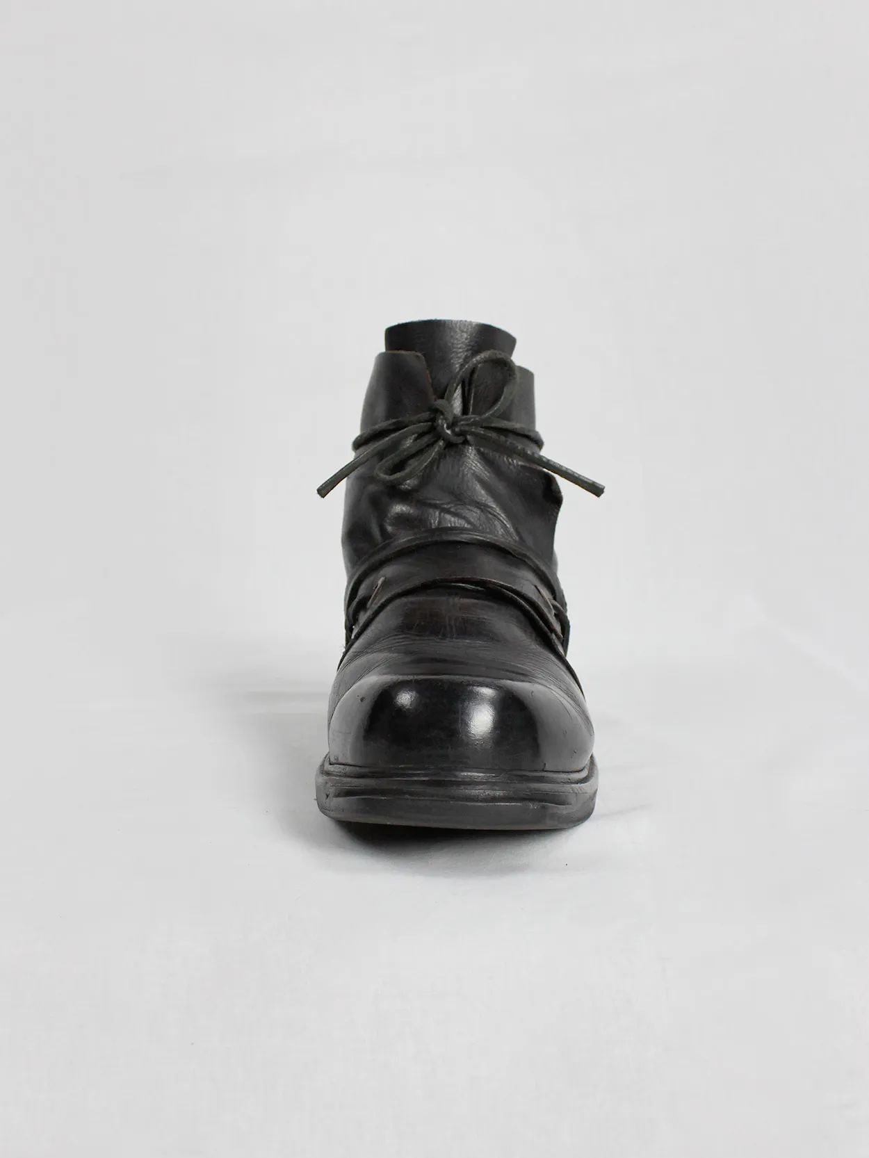 Black mountaineering boots with laces through the soles by Dirk Bikkembergs, size 42, from the late 1990s.