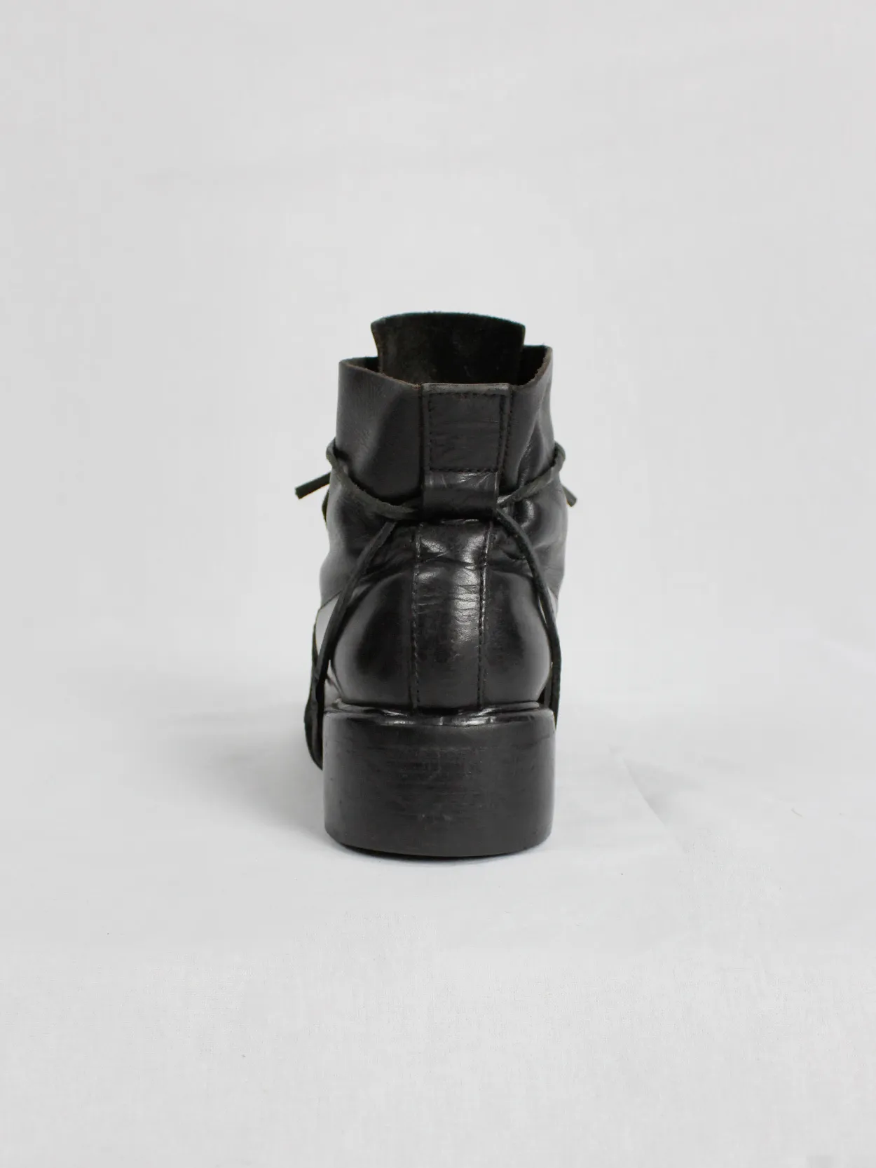 Black mountaineering boots with laces through the soles by Dirk Bikkembergs, size 42, from the late 1990s.