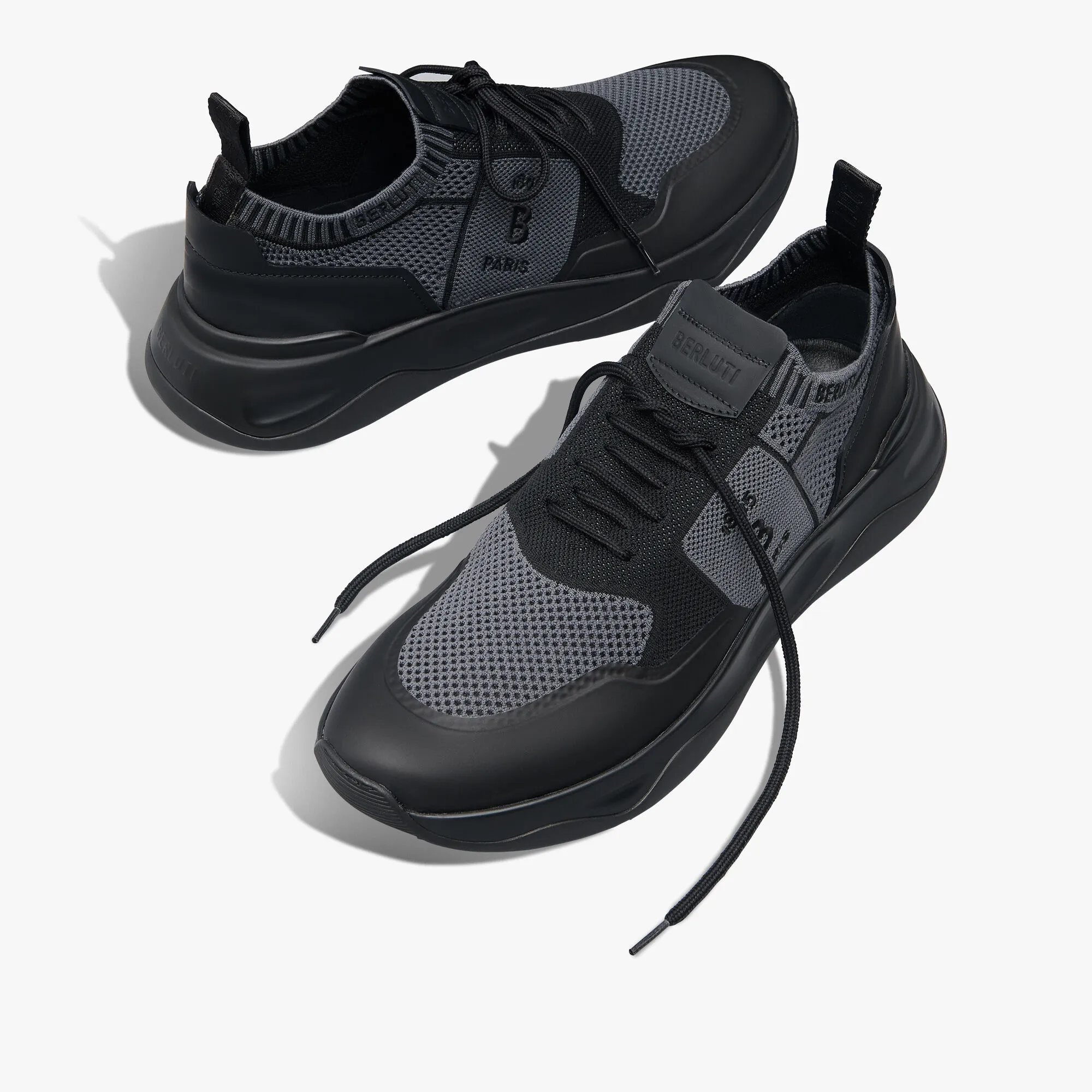 Sleek Rubber Coated Knit and Calf Leather Sneaker